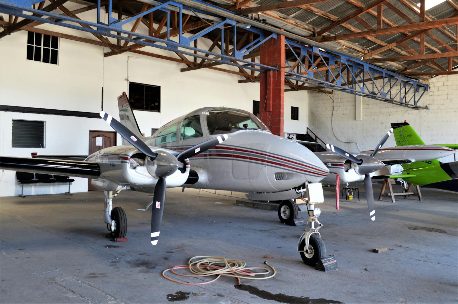 Aircraft in a maintenance hangar representing RWAS repair-station maintenance work